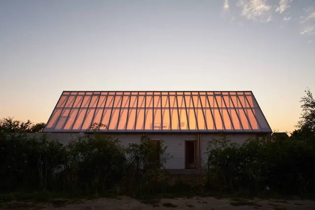Modern Glass Structure at Sunset
