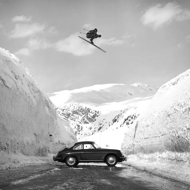 Snowboarder and Vintage Car in Mountains