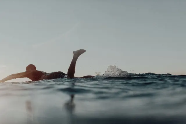 Person Swimming in Water