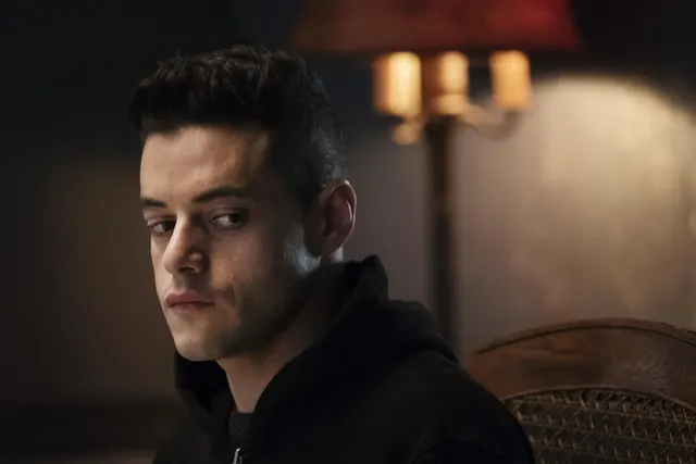 Portrait of a man in a dimly lit room