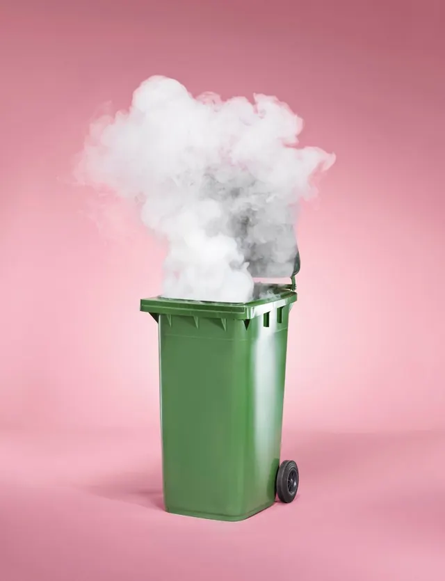 Green Trash Bin with Smoke