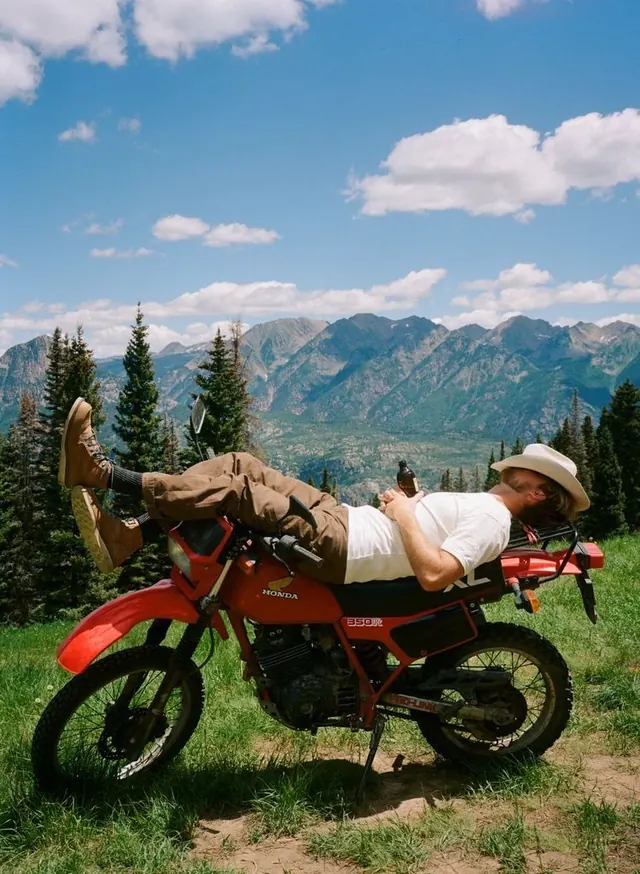 Motorcyclist in Mountain Landscape