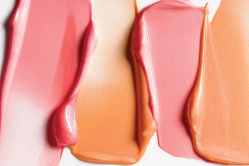 Warm pink and coral makeup swatches, photographic, minimal, warm