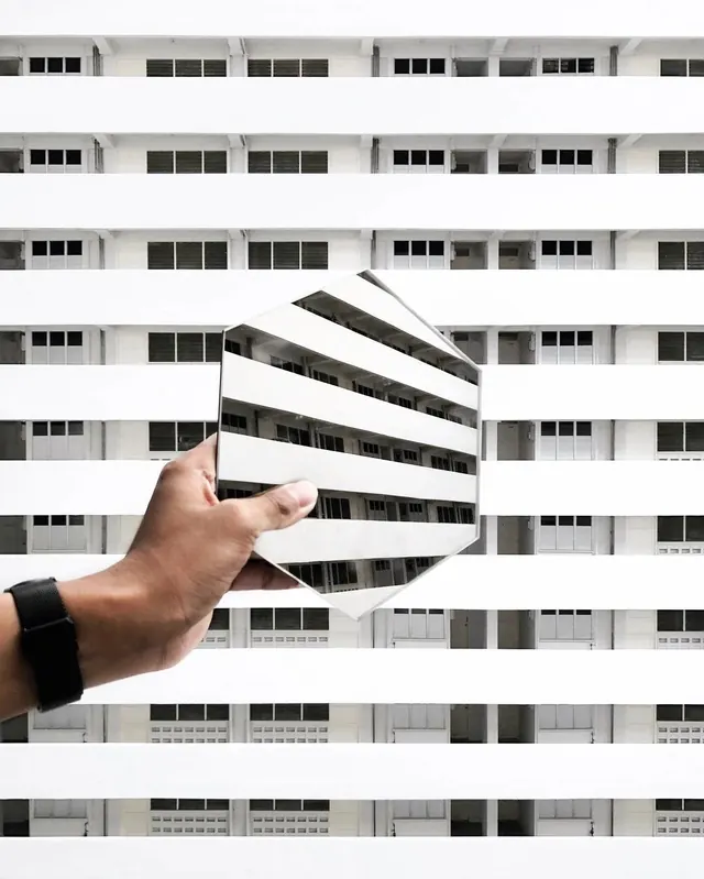 Hand holding geometric abstract graphic, minimal, monochrome, monochrome
