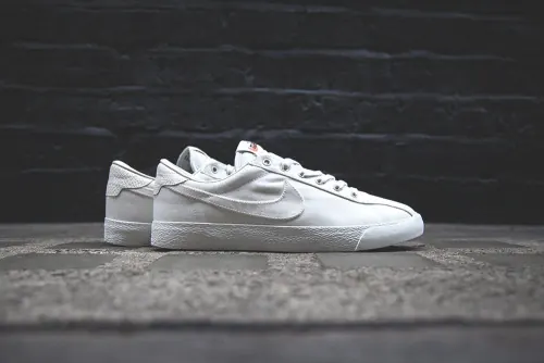 White Sneakers on Textured Surface