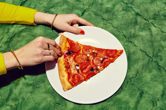 Pizza on Green Textured Surface