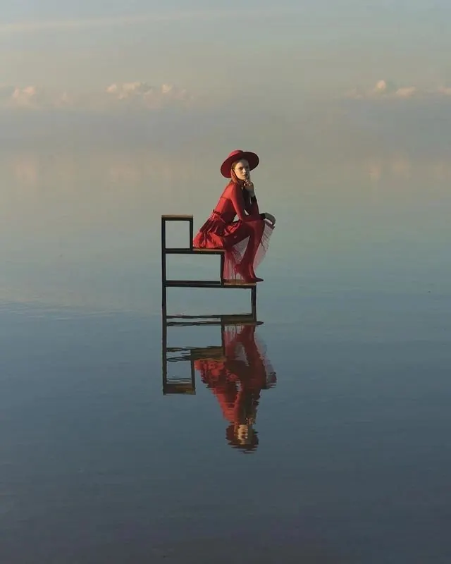 Reflective Figure on Bench