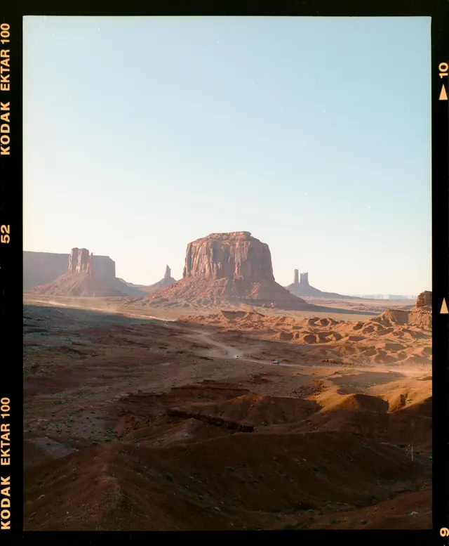 Monument Valley at golden hour on Kodak film, photographic, warm