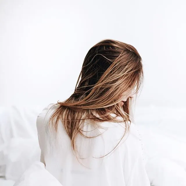 Woman in White Bedding
