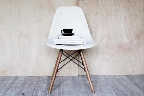 White Eames-style Chair with Laptop