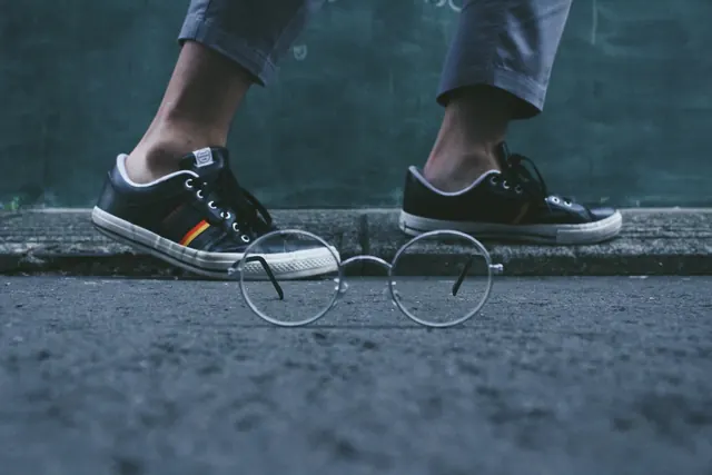 Person in Sneakers with Glasses