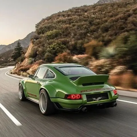 Green Sports Car on Mountain Road