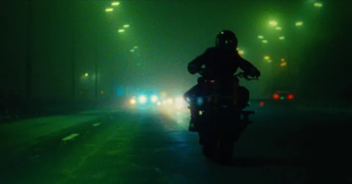 Motorcyclist in Night Traffic