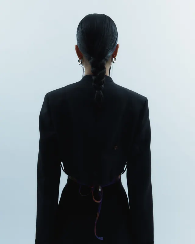 Back View Portrait in Dark Attire