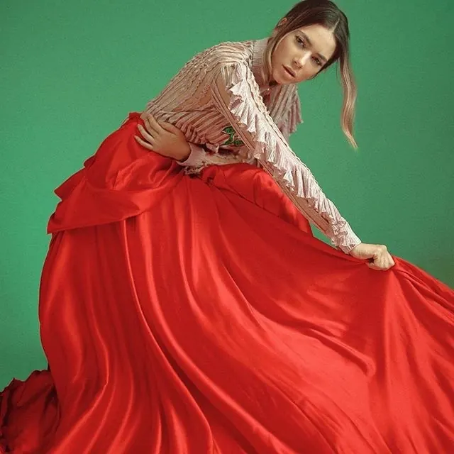 Woman in Red Gown and Sheer Blouse