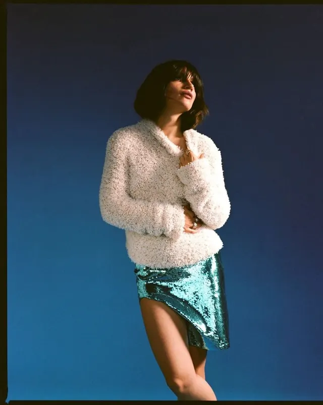 Portrait of a woman in textured knitwear
