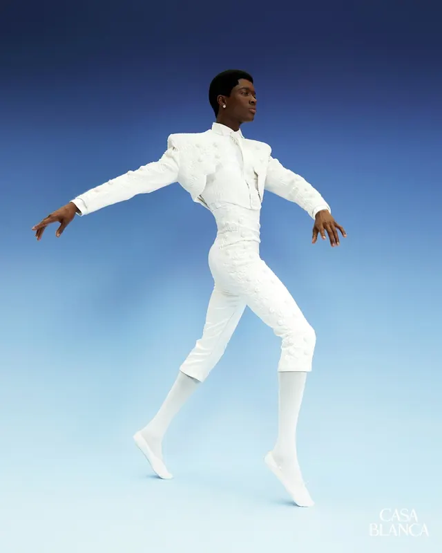 Dynamic Dancer in White Attire