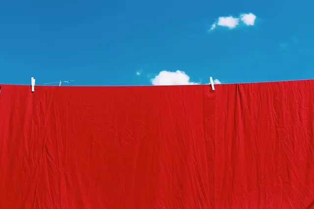 Red Fabric Against Blue Sky