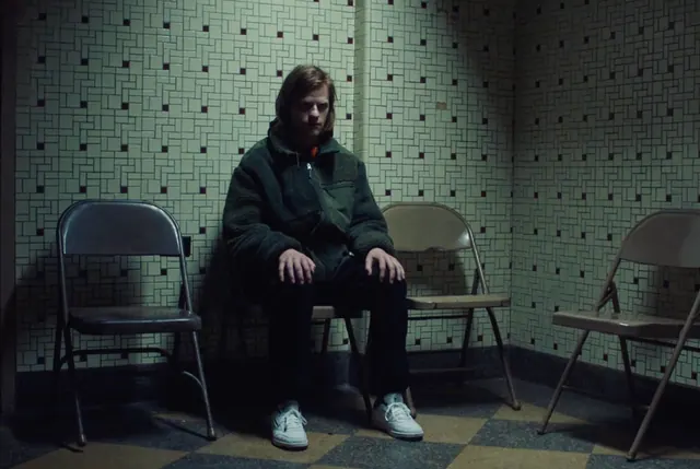 Man in Tiled Room