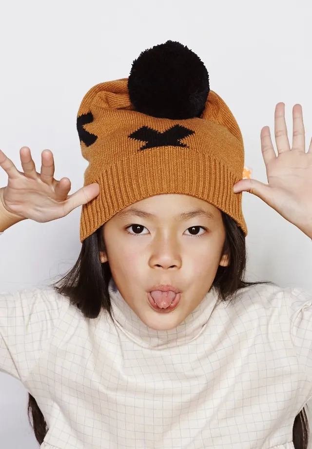 Portrait of a person in a knit beanie