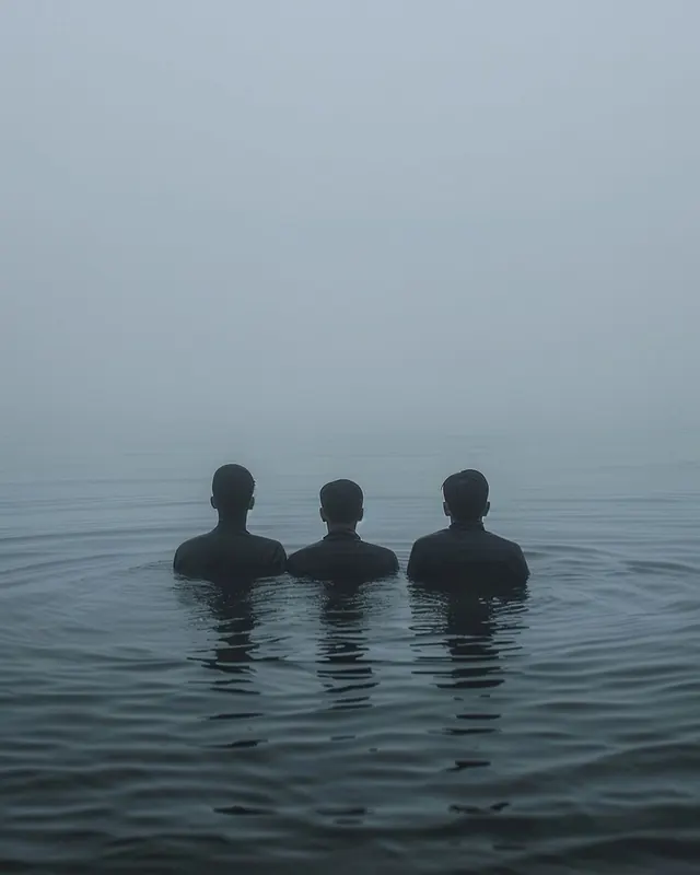Silhouetted Figures in Fog