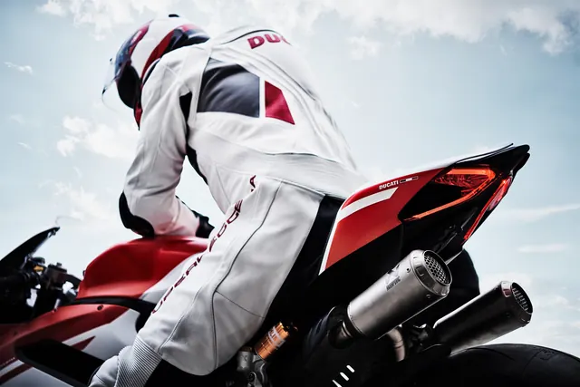 Ducati Superleggera rider low angle, photographic, dark