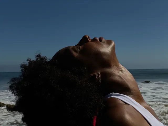 Portrait of a woman against a blue sky