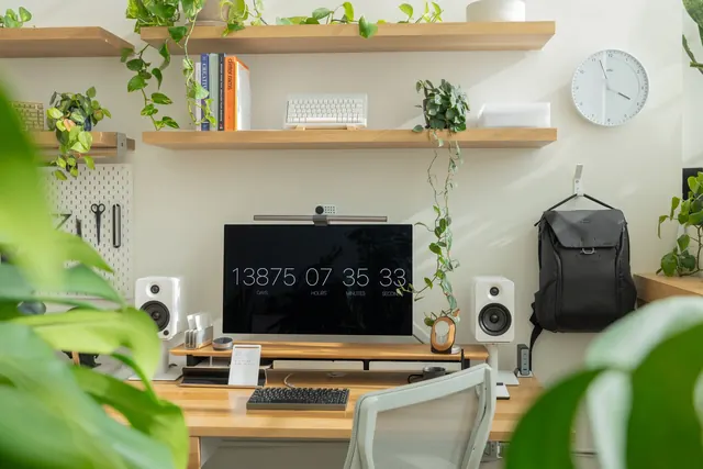 Plant-filled minimal desk setup, minimal, light-mode, light