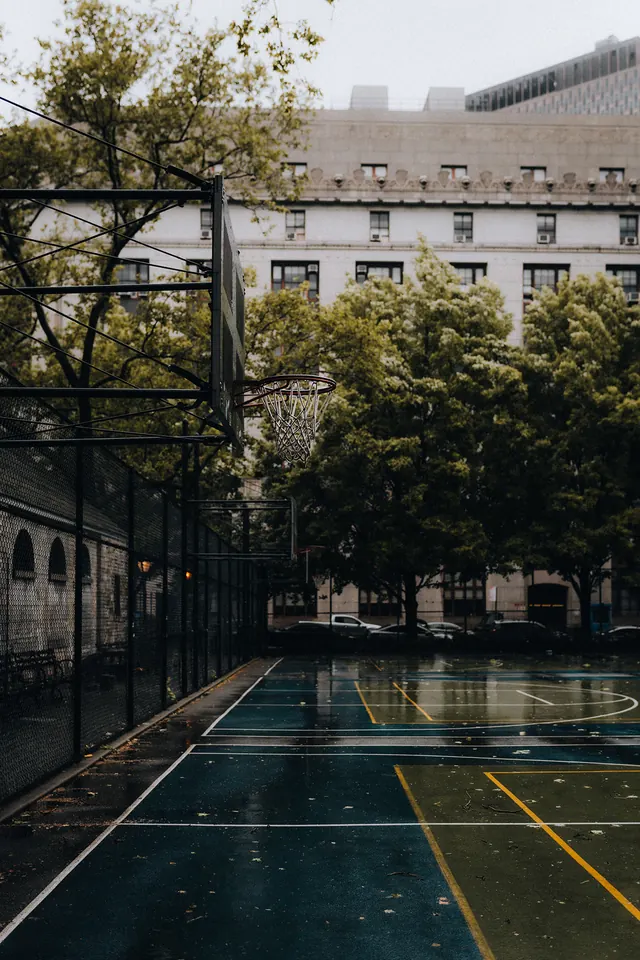 Wet urban basketball court, photographic, minimal, cool
