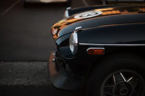 Vintage black roadster detail, photographic, retro, dark