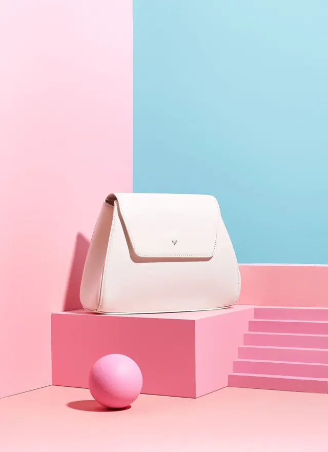 Pastel geometric handbag product shot, minimal, photographic, pastel