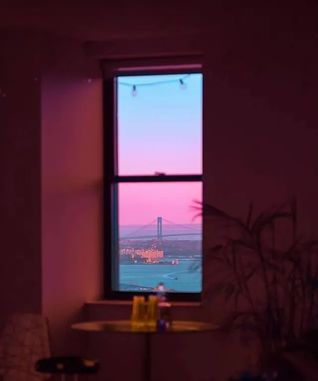 Sunset bridge view through window, photographic, cinematic, vibrant