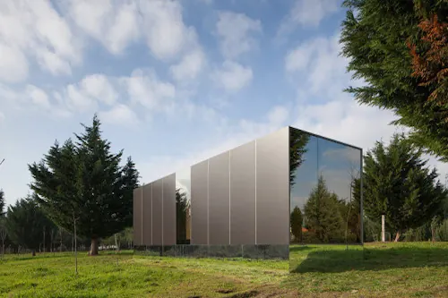 Reflective modular cabin in landscape, minimal, photographic, light