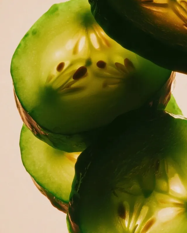 Backlit cucumber slices macro photo, organic, photographic, vibrant