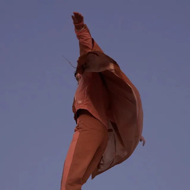 Rust techwear jump on lavender field, minimal, photographic, vibrant