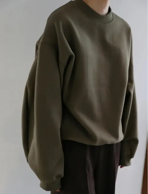 Olive oversized sweatshirt fashion detail, minimal, photographic, muted