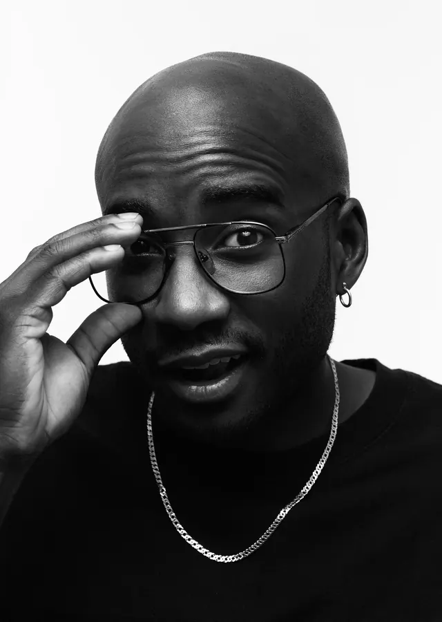 Black and white portrait adjusting aviator glasses, editorial, photographic, monochrome