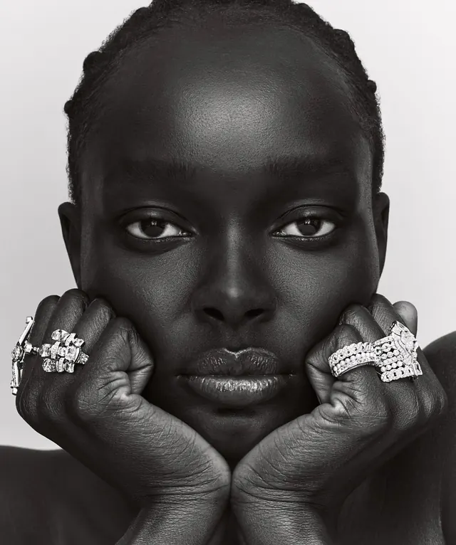 Diamond rings portrait chin on fists, luxury, editorial, monochrome