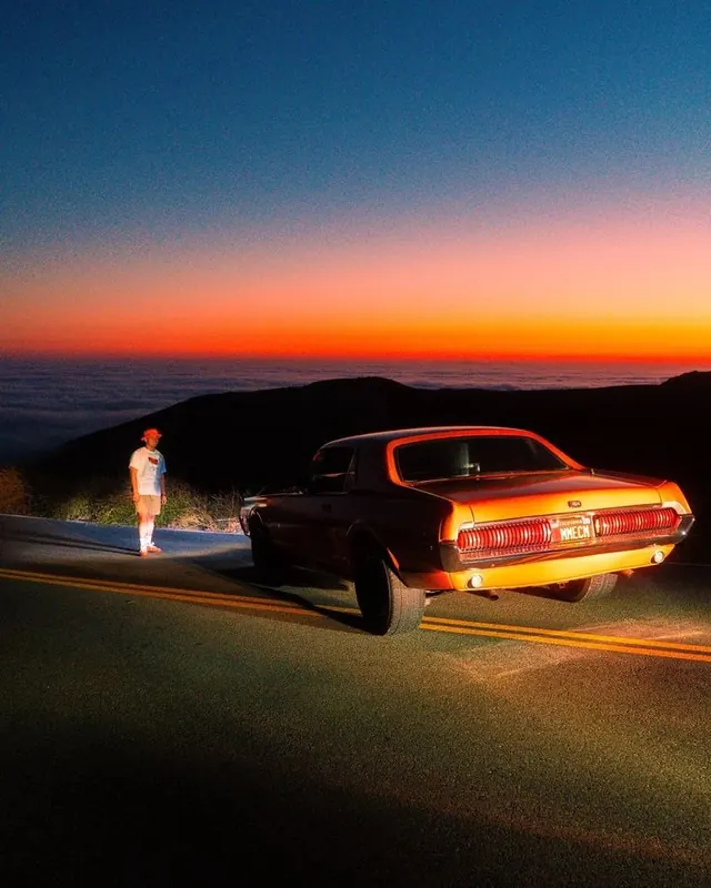 Orange muscle car at sunset, photographic, retro, warm