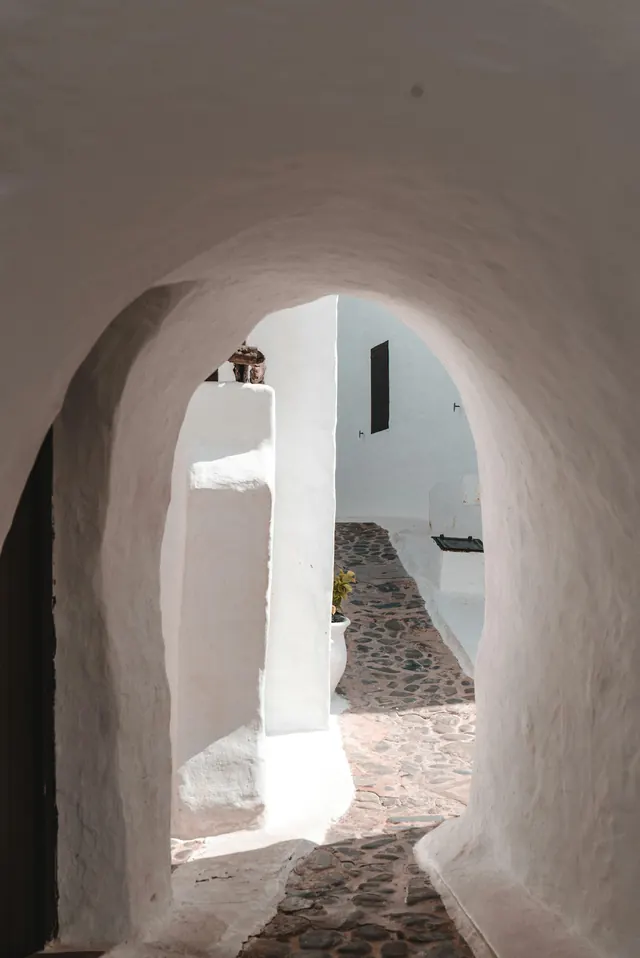 Whitewashed alley archway, minimal, photographic, light