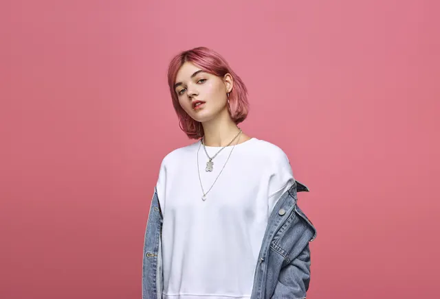 Pink hair studio portrait, minimal, photographic, vibrant