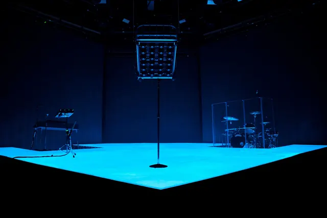Blue neon concert stage, minimal, technical, dark