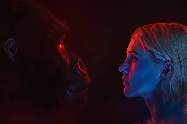 Gorilla and woman profiles in red and blue light, photographic, cinematic, dark