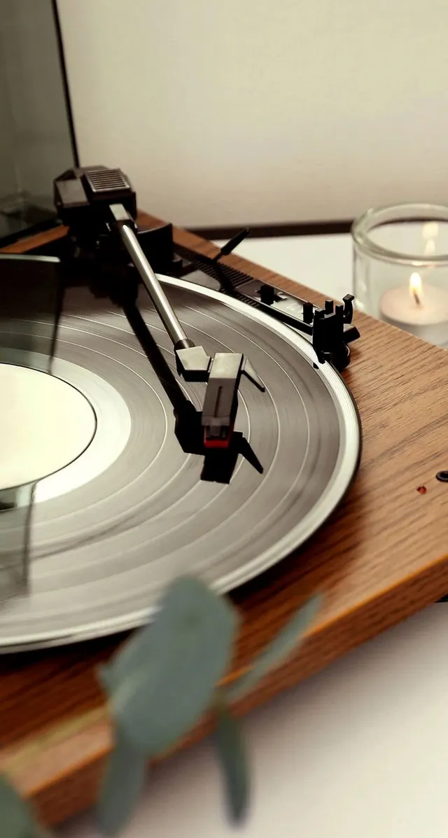 Turntable and candle still life, minimal, photographic, warm