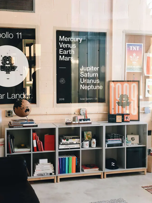Design studio wall with modular shelves, minimal, photographic, light
