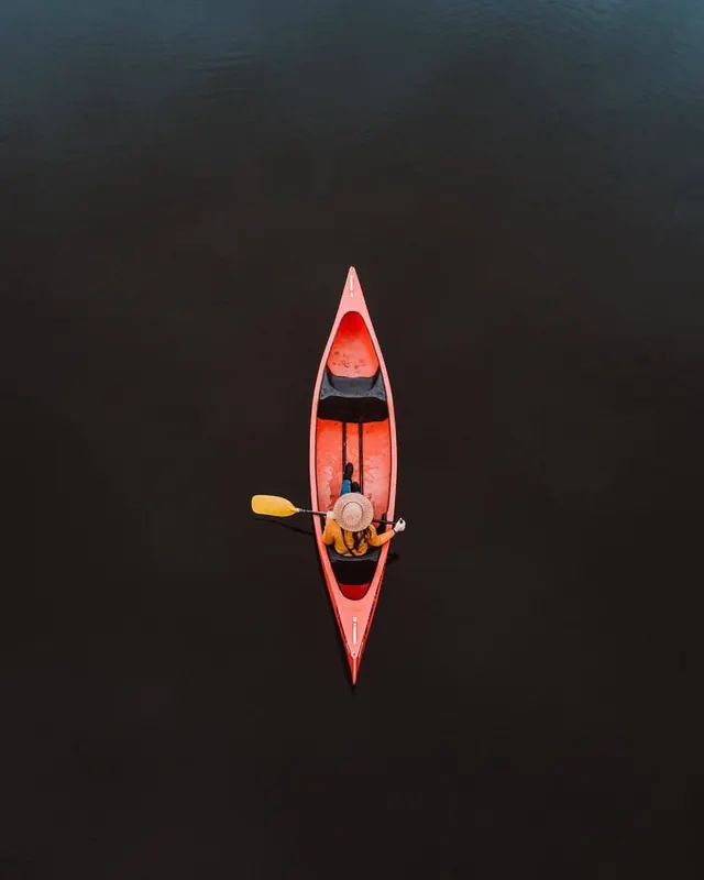 Kayaker in Dark Water