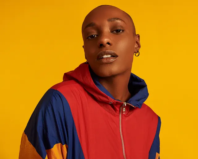 Portrait of a person in a multi-colored hoodie