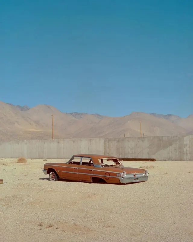 Vintage Car in Desert Landscape
