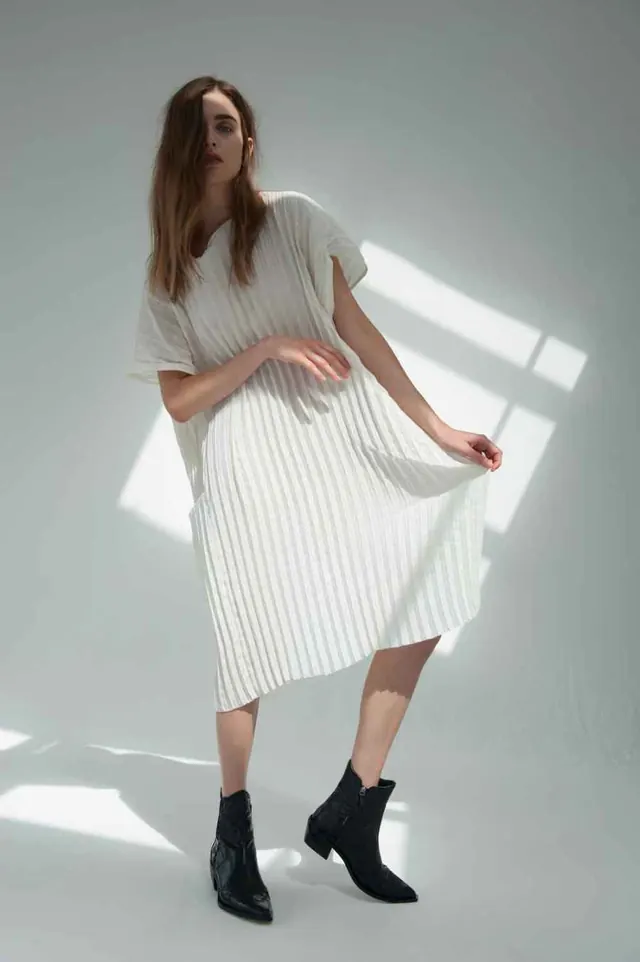 Model in White Pleated Dress