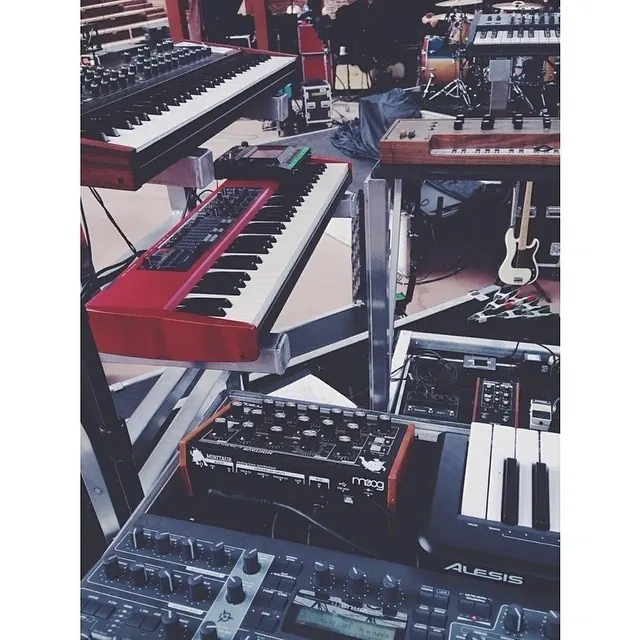 Synthesizer and keyboard studio setup, photographic, technical, muted